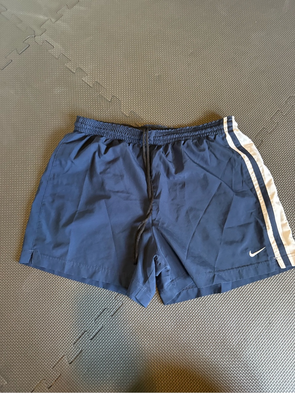 Nike Men’s Navy Athletic Shorts with White Side Stripes and Swoosh